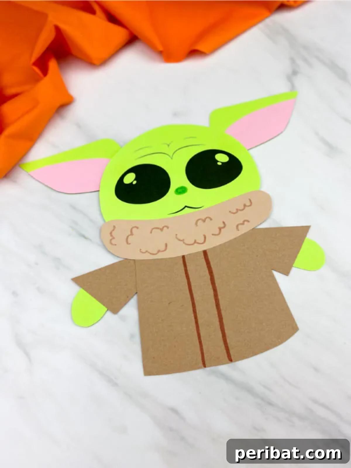 A paper craft of Grogu (Baby Yoda) from The Mandalorian, with a printable template.