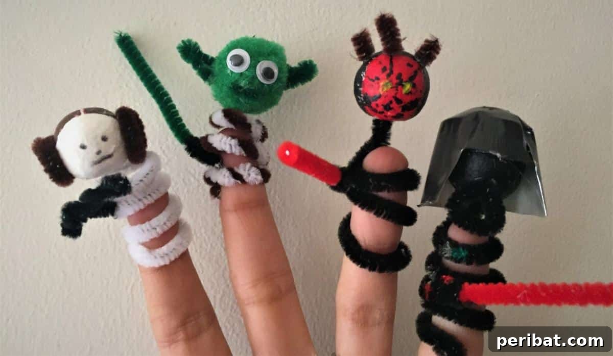 Star Wars characters made into finger puppets using pipe cleaners, displayed on fingers.