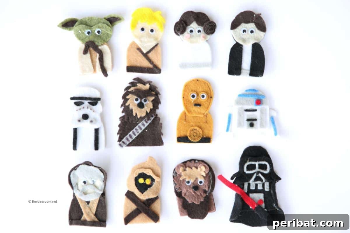 Close-up of Star Wars finger puppets, including Yoda, Darth Vader, and a Stormtrooper, made from felt or paper.