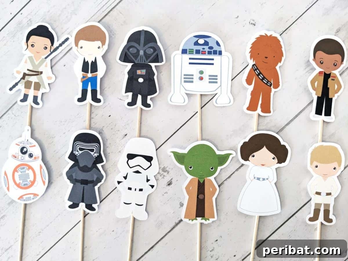 Cupcakes adorned with Star Wars character-themed toppers, making them festive for parties.