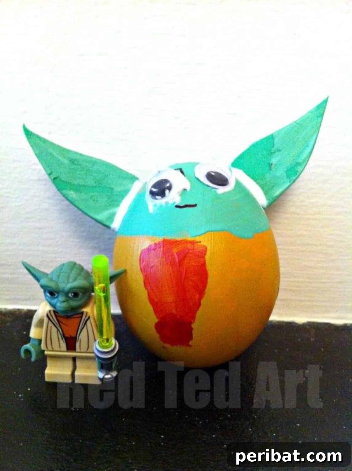 A decorated Easter egg made to look like Master Yoda, complete with green ears.