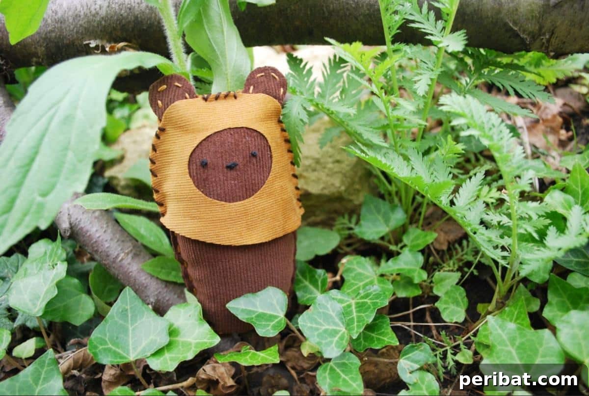 An adorable mini Ewok softie plush toy, crafted with soft fabric.