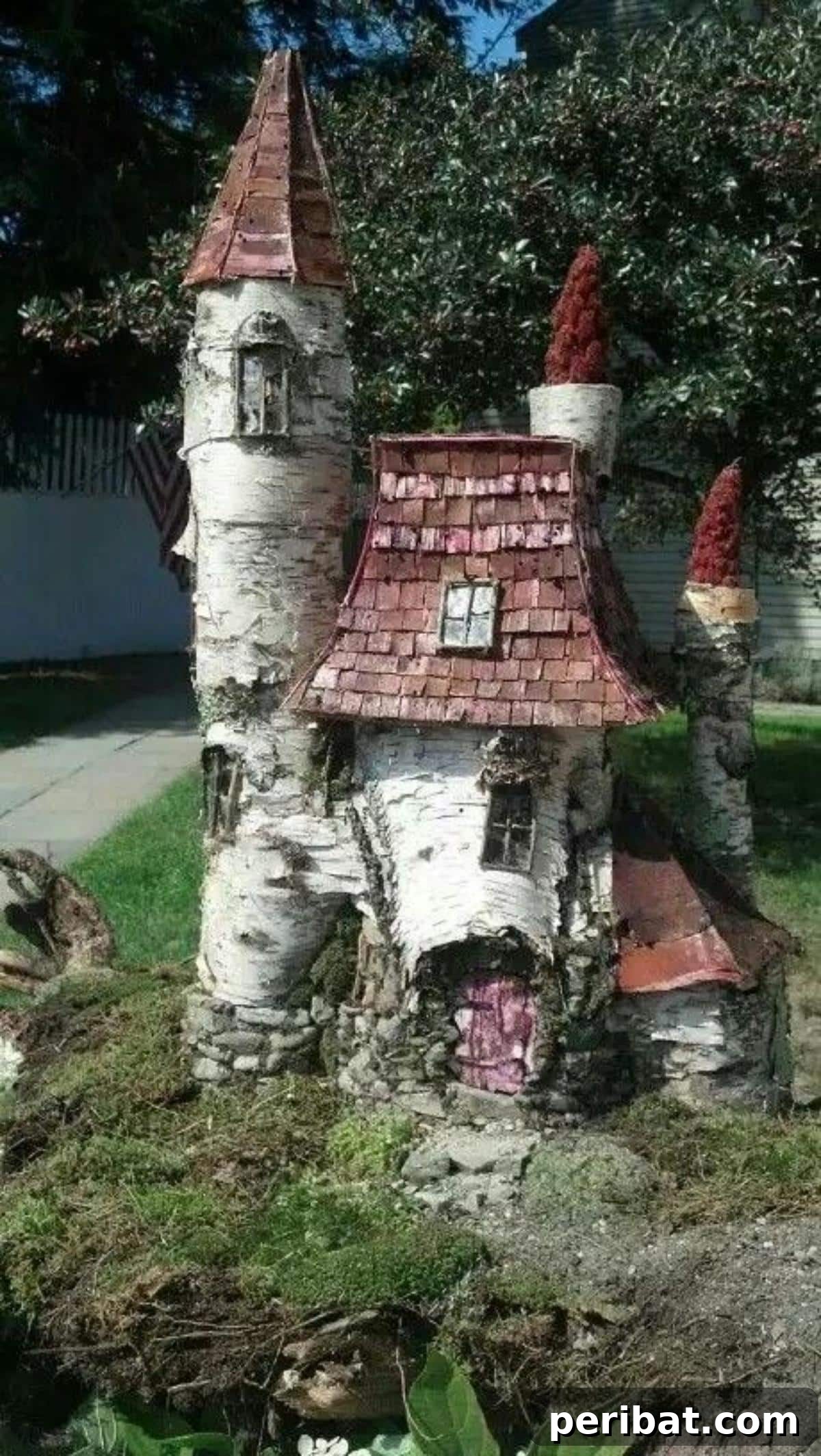 Stump to Splendor Ingenious Garden Planters and Ornaments 20 Whimsical birch fairy castle with shingled roof and turrets on a tree stump