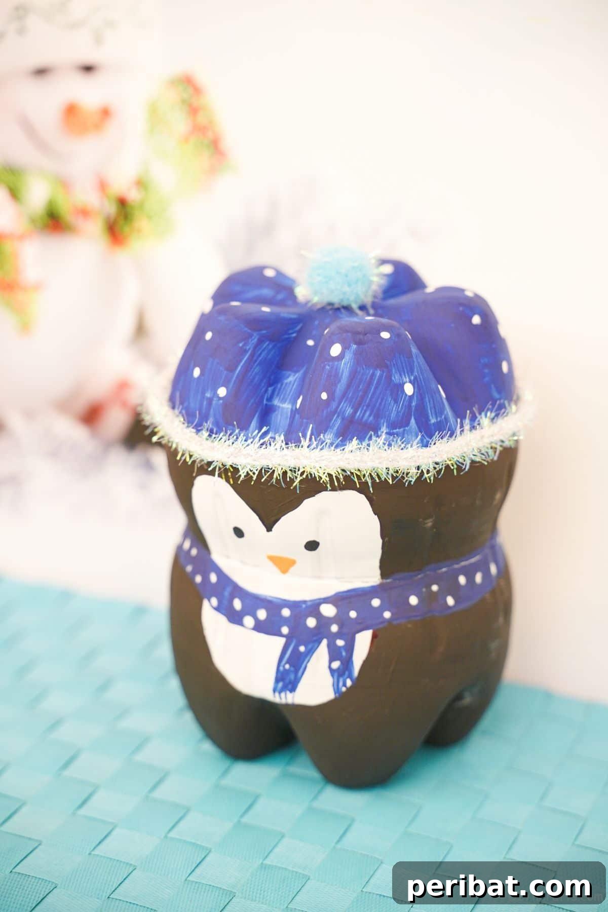 Waddle into Fun: 40 Penguin Craft Projects 3 Upcycled Plastic Bottle Penguin Kids Craft with paint and felt details.