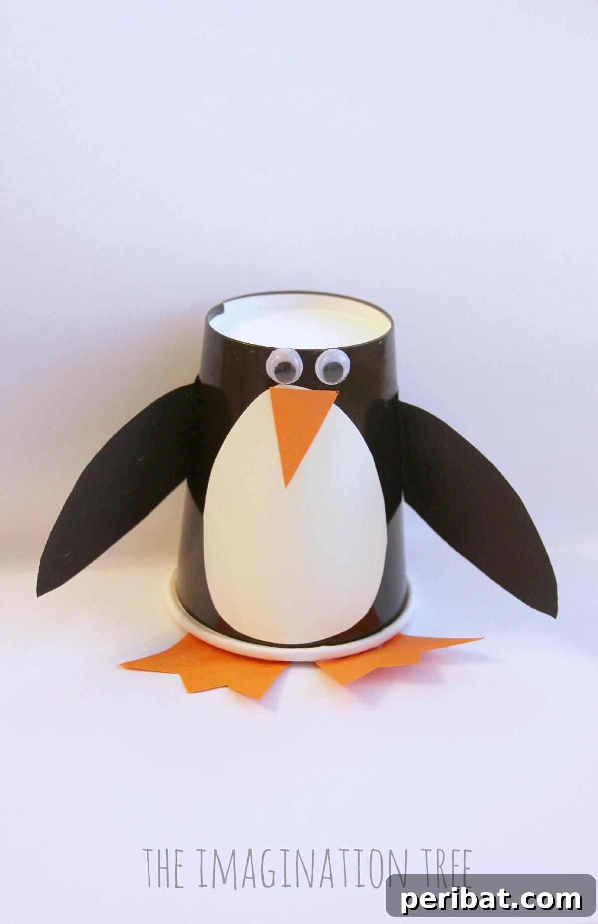Waddle into Fun: 40 Penguin Craft Projects 25 Paper Cup Penguin Craft Roll & Make Game, mixing crafting and games for family fun.