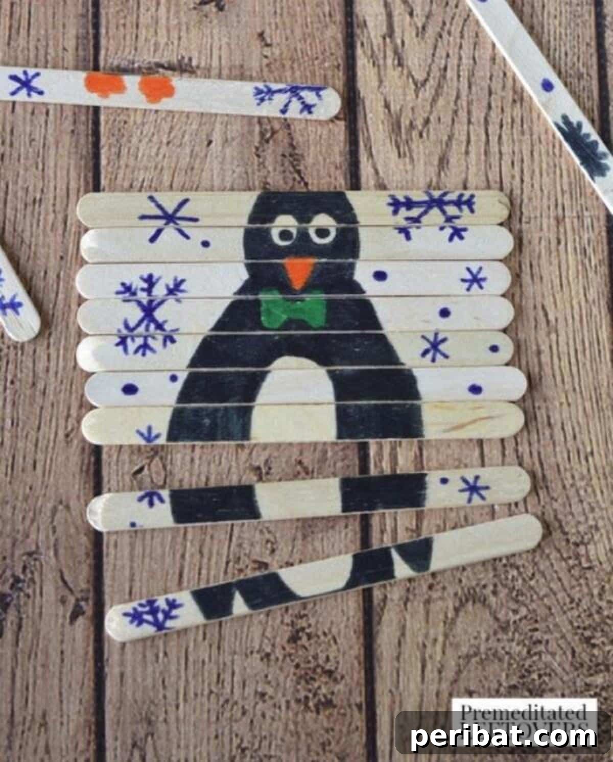 Waddle into Fun: 40 Penguin Craft Projects 26 Popsicle Stick Penguin Puzzle Craft, a fun and instructive activity for kids.