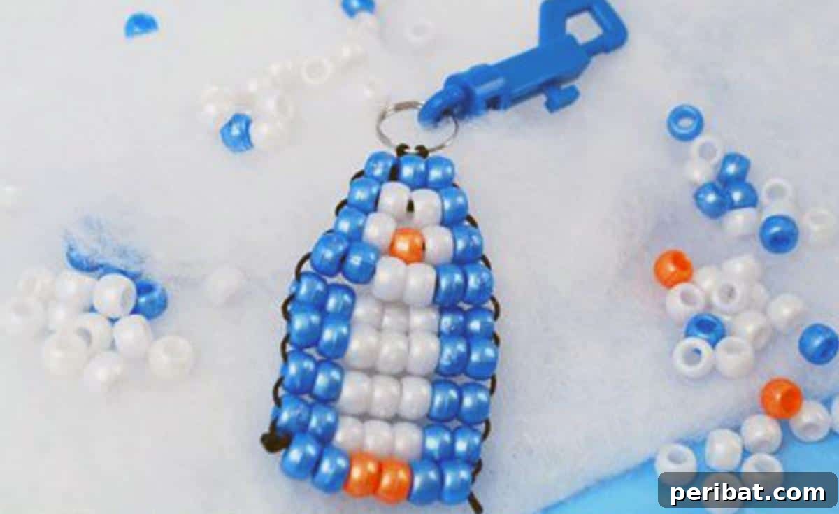 Waddle into Fun: 40 Penguin Craft Projects 29 Penguin Bead Pet, a playful penguin keychain made from colorful beads.