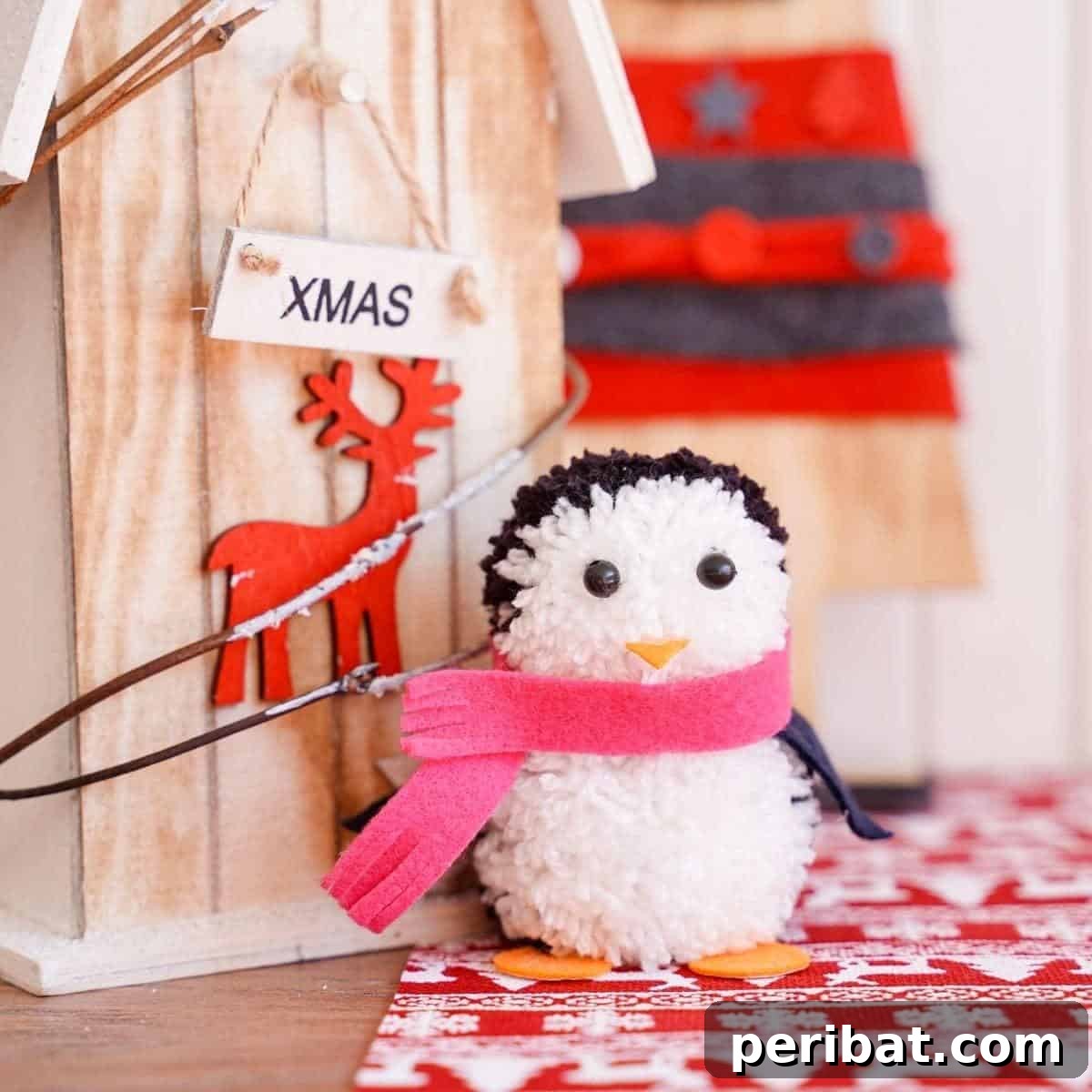 Waddle into Fun: 40 Penguin Craft Projects 6 Adorable Pom Pom Penguin Winter Decoration made from black and white yarn.
