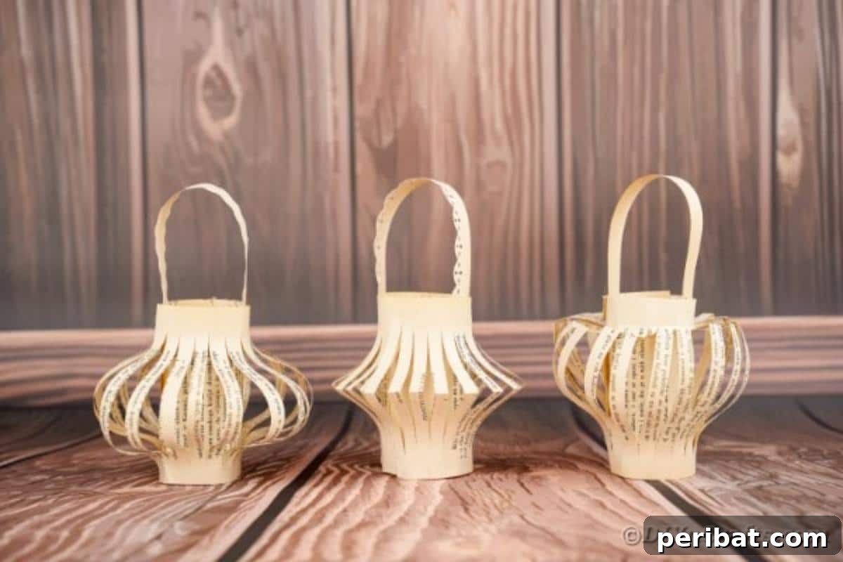 40 Colorful Construction Paper Creations 21 Simple hanging paper lanterns crafted from delicate book pages, casting a soft, warm glow, perfect for a cozy, literary ambiance.