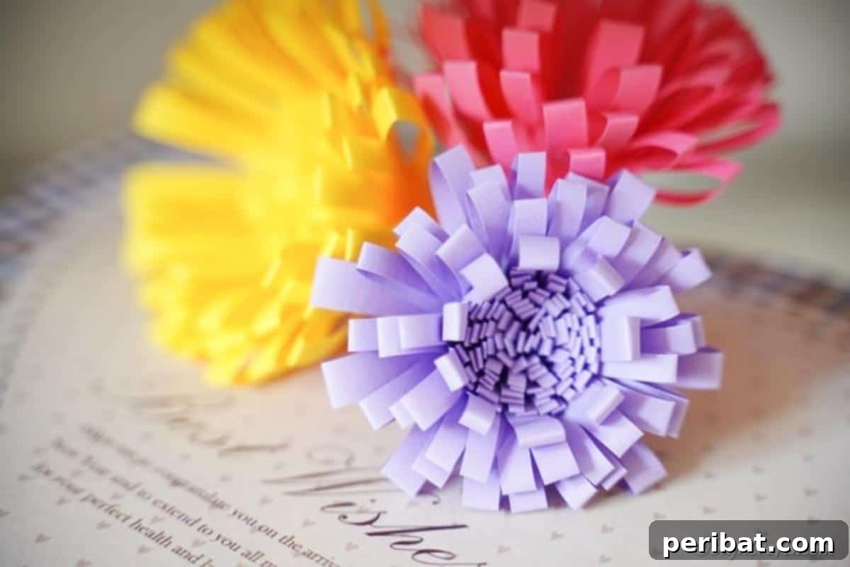 40 Colorful Construction Paper Creations 22 A stunning bouquet of beautiful DIY decorative paper flowers in various shades of pink and red, intricately crafted and arranged.
