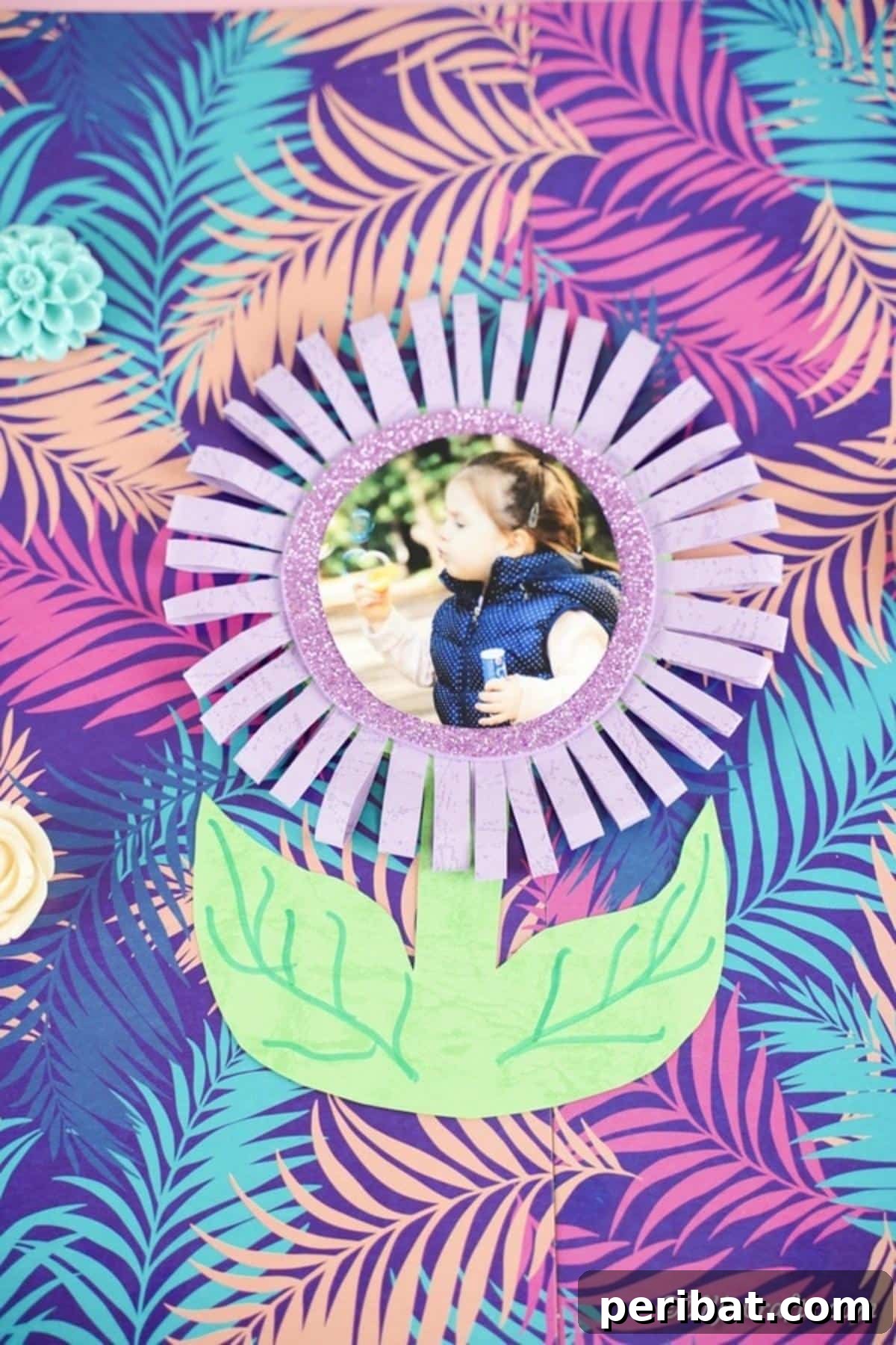 40 Colorful Construction Paper Creations 23 A beautiful DIY paper flower photo card, featuring a charming floral arrangement made from colored paper surrounding a cherished photograph.