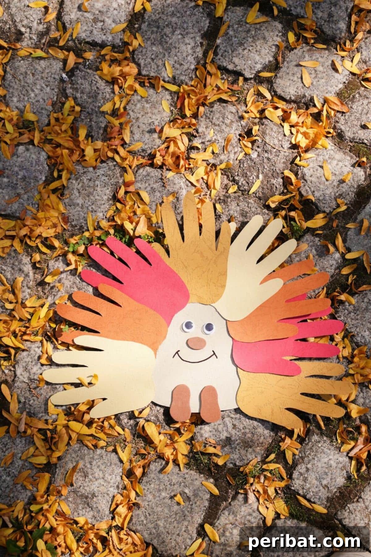 40 Colorful Construction Paper Creations 34 An easy handprint hedgehog preschool kids' craft, made with a brown handprint as the body and drawn quills, featuring googly eyes and a friendly smile.