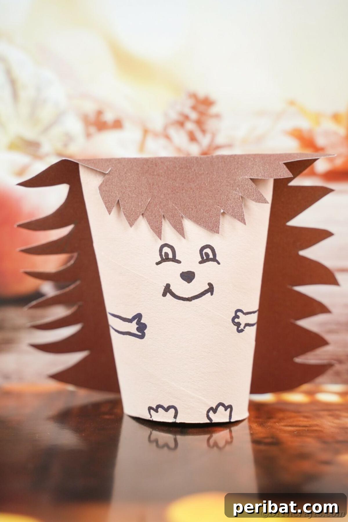 40 Colorful Construction Paper Creations 5 An adorable toilet paper roll hedgehog craft for fall, made with brown construction paper for the body and cut paper strips for the quills, with googly eyes and a friendly smile.