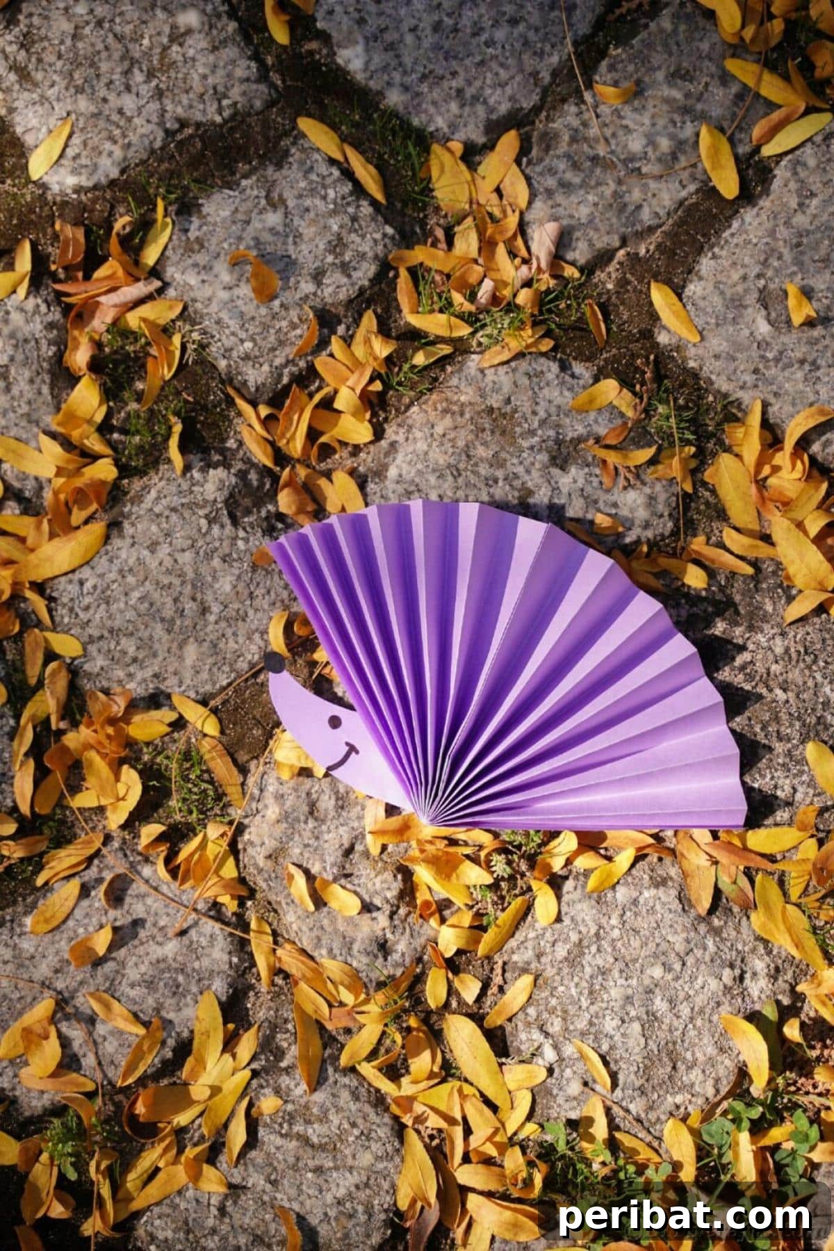 40 Colorful Construction Paper Creations 7 An adorable paper fan hedgehog craft for kids, made from folded construction paper to create a textured body, with a separate head and googly eyes.