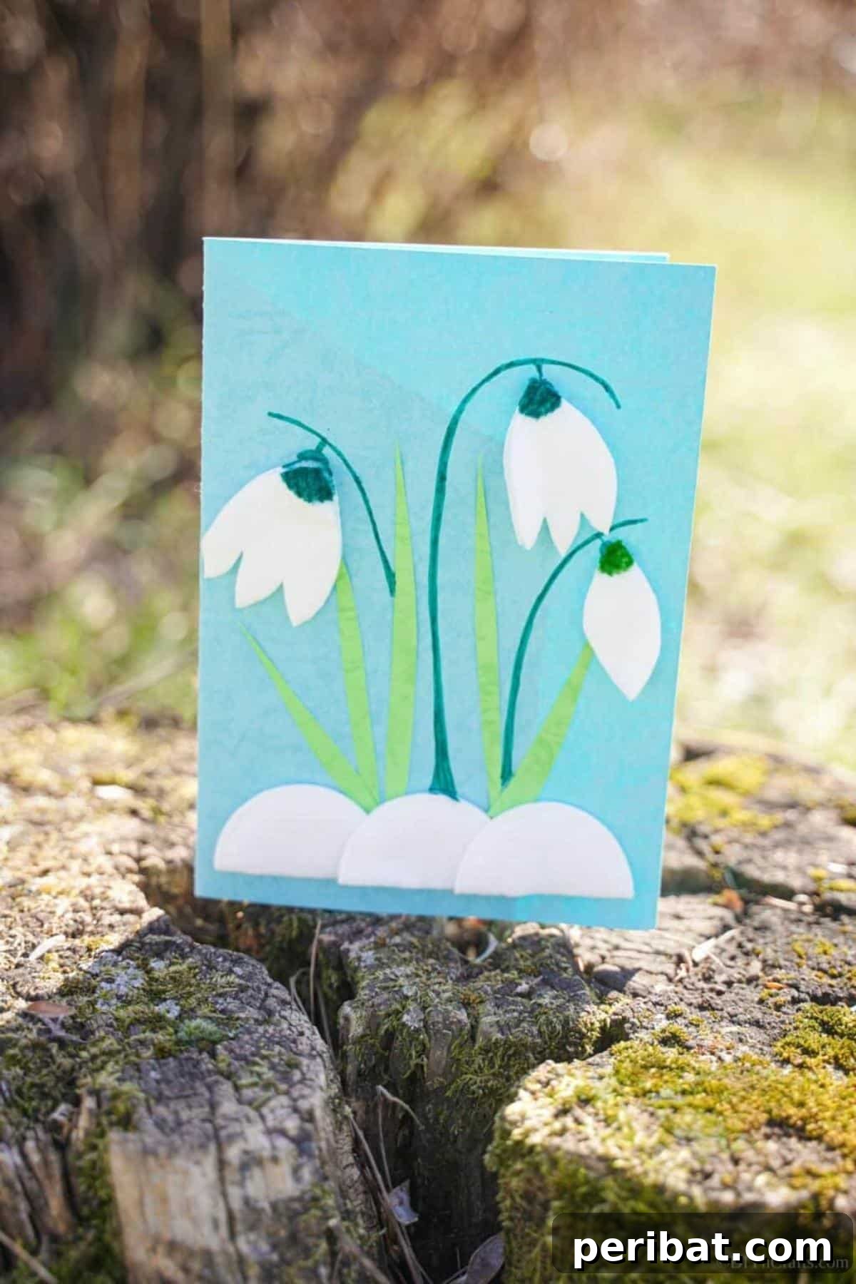 40 Colorful Construction Paper Creations 9 A beautiful handmade card adorned with a delicate paper tulip, crafted from colored paper with intricate details, ideal for personalized greetings.