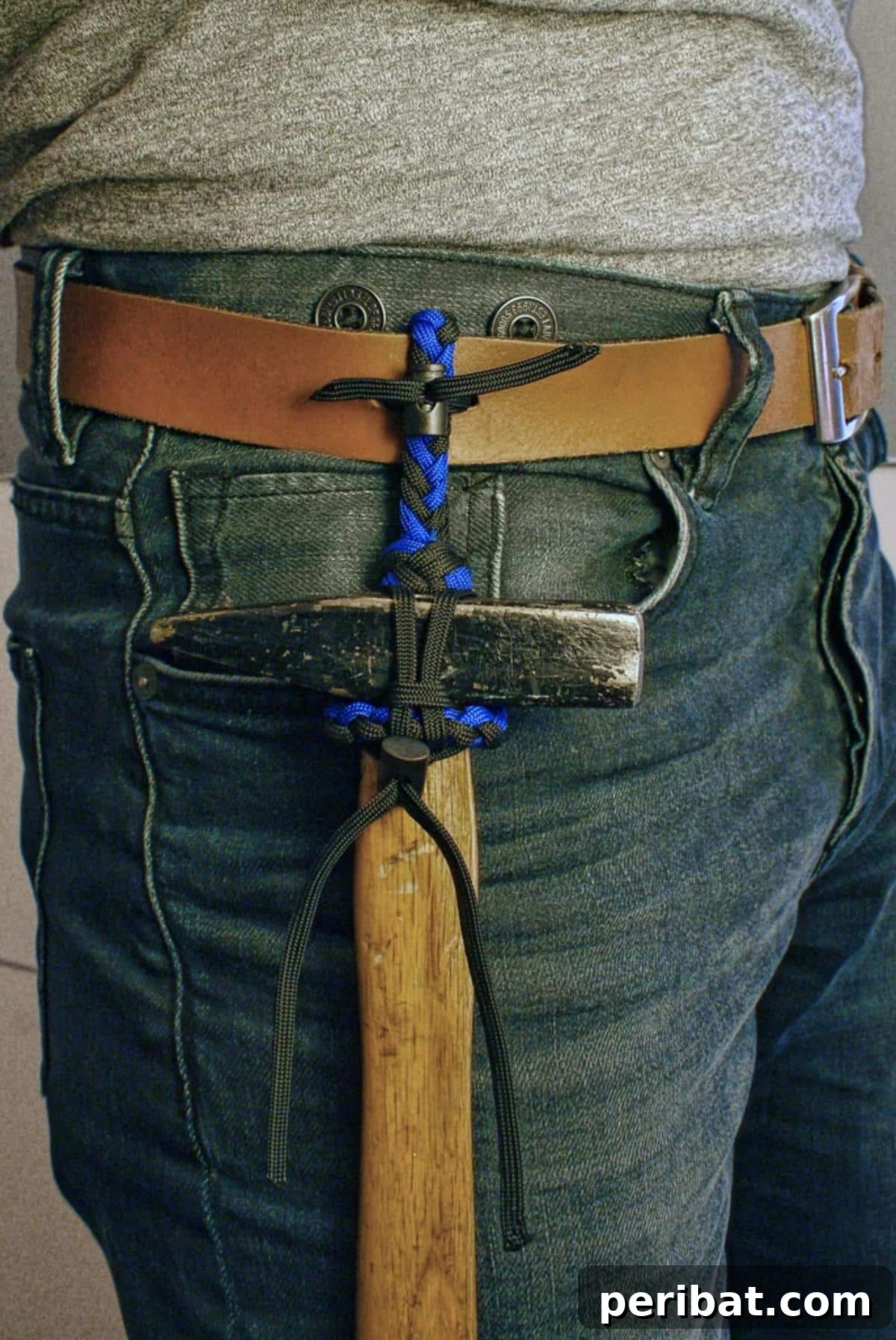 Crafting with Paracord: DIY Ideas and Projects 23 Robust Paracord Hammer Holder for easy tool access.