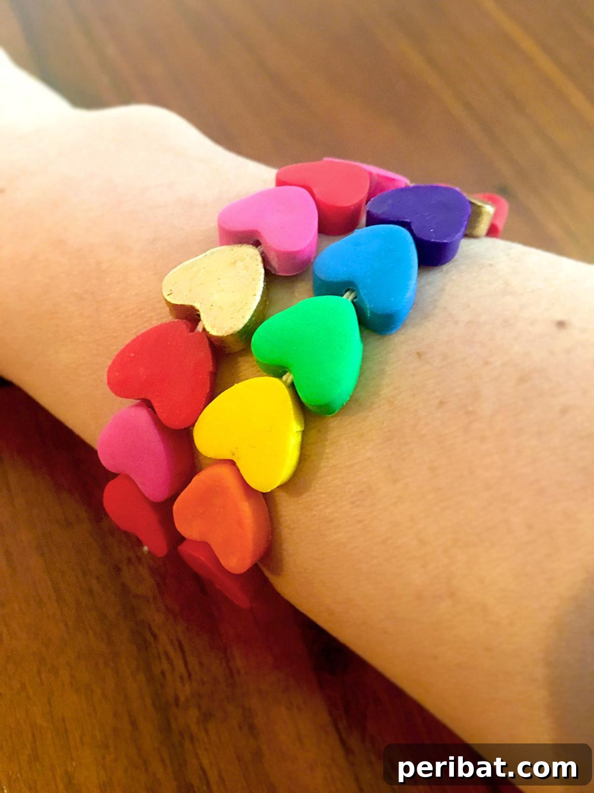 Vibrant polymer clay heart bracelets in various colors.