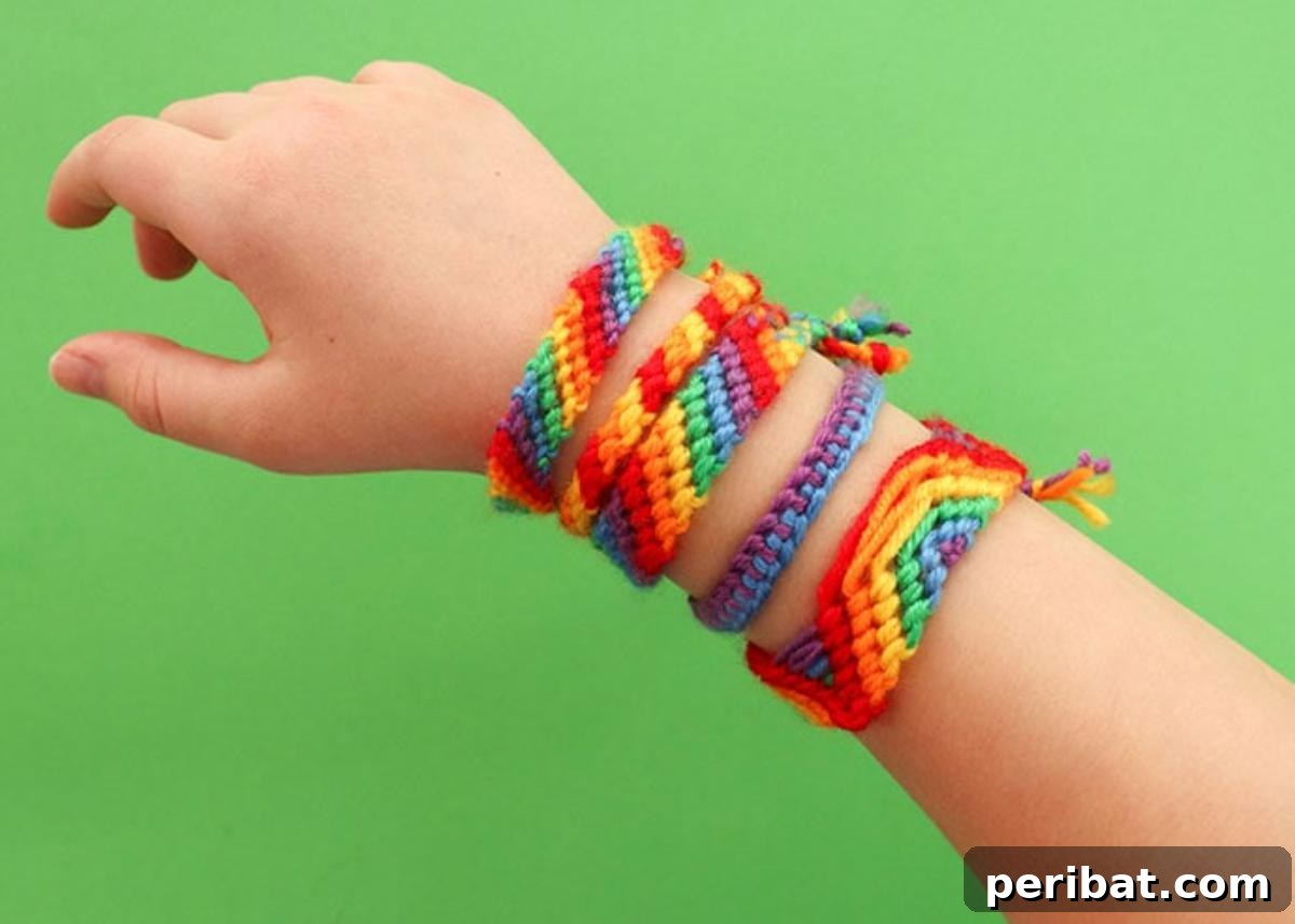 A collection of bright rainbow friendship bracelets.