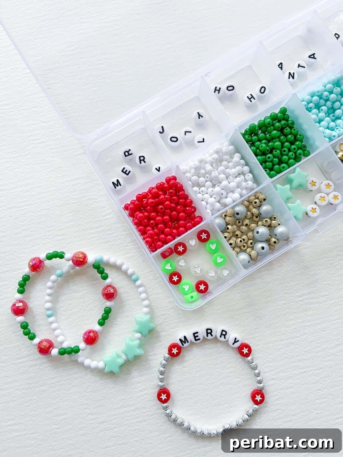 A DIY stretchy bracelet kit with colorful beads, elastic cords, and letter charms.