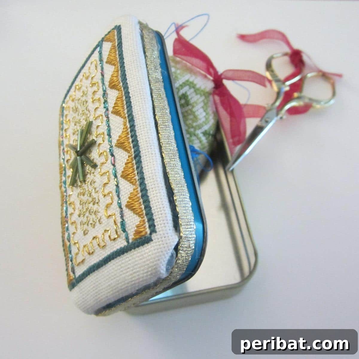 From Mint to Masterpiece: 40 Altoid Tin DIYs 18 Altoid Tin Padded Box Topper