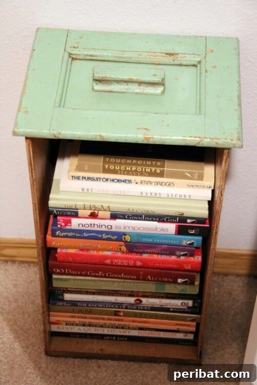 15 Unexpected Uses for Your Old Drawers 12 Unique bookcase or side table made from stacked repurposed drawers, holding books and decor