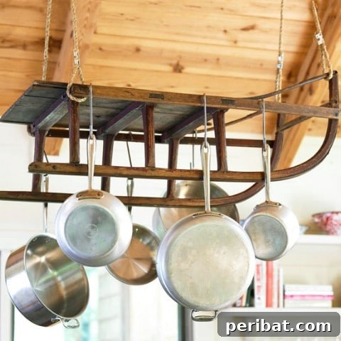 Kitchen utensils with hanging loops displayed on hooks under cabinets