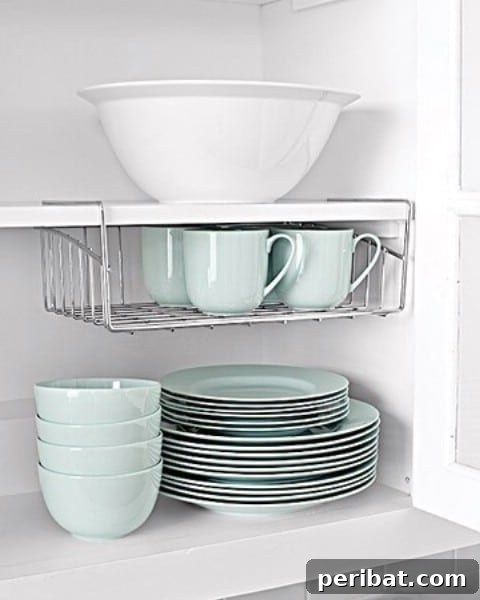 Undershelf basket maximizing vertical space in a kitchen cabinet
