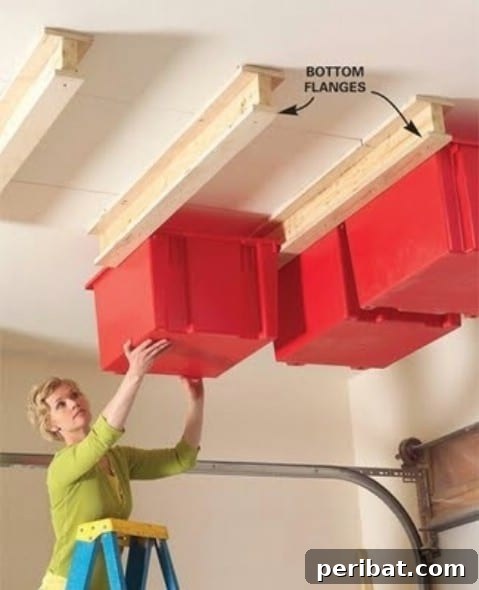 DIY sliding storage system with plastic bins mounted on a garage ceiling