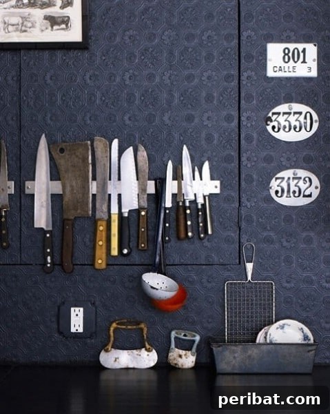 Magnetic rack storing kitchen knives and metal utensils on a wall