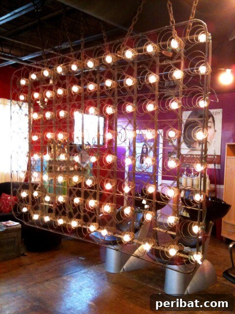 From Scrap to Chic 15 Creative Uses for Old Bed Springs 17 Upcycled bed spring frame room divider with lights