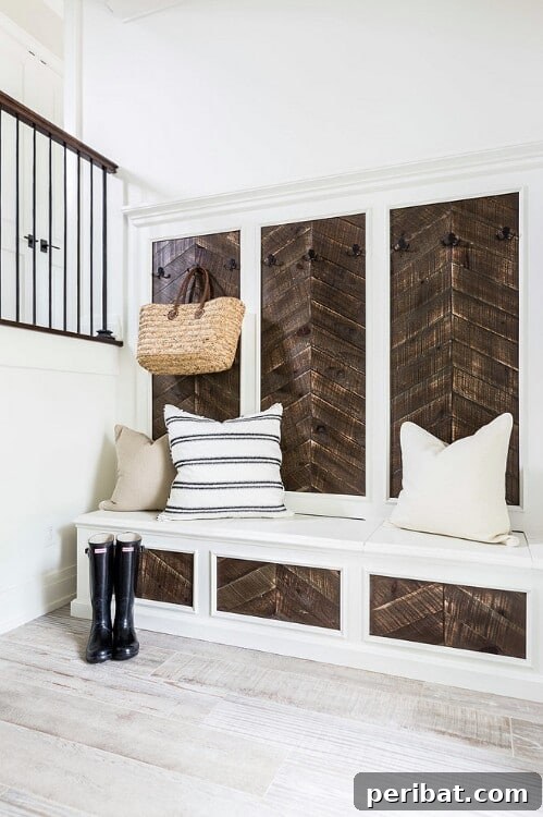 Reclaimed Wood Wonders for a Stylish Sustainable Home 11 Mudroom bench with chevron pattern drawers and backboard