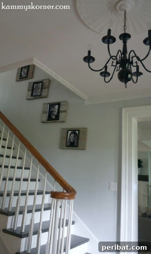 Reclaimed Wood Wonders for a Stylish Sustainable Home 31 Family photos framed with reclaimed wood along a staircase