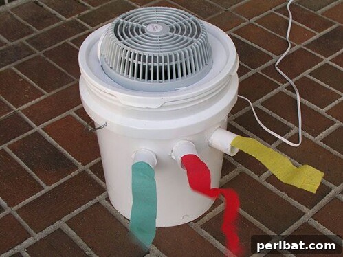 55+ Ultimate Camping Hacks to Master the Wilderness 55 A DIY camping air conditioner made from a Styrofoam cooler and a small fan for temporary cooling.