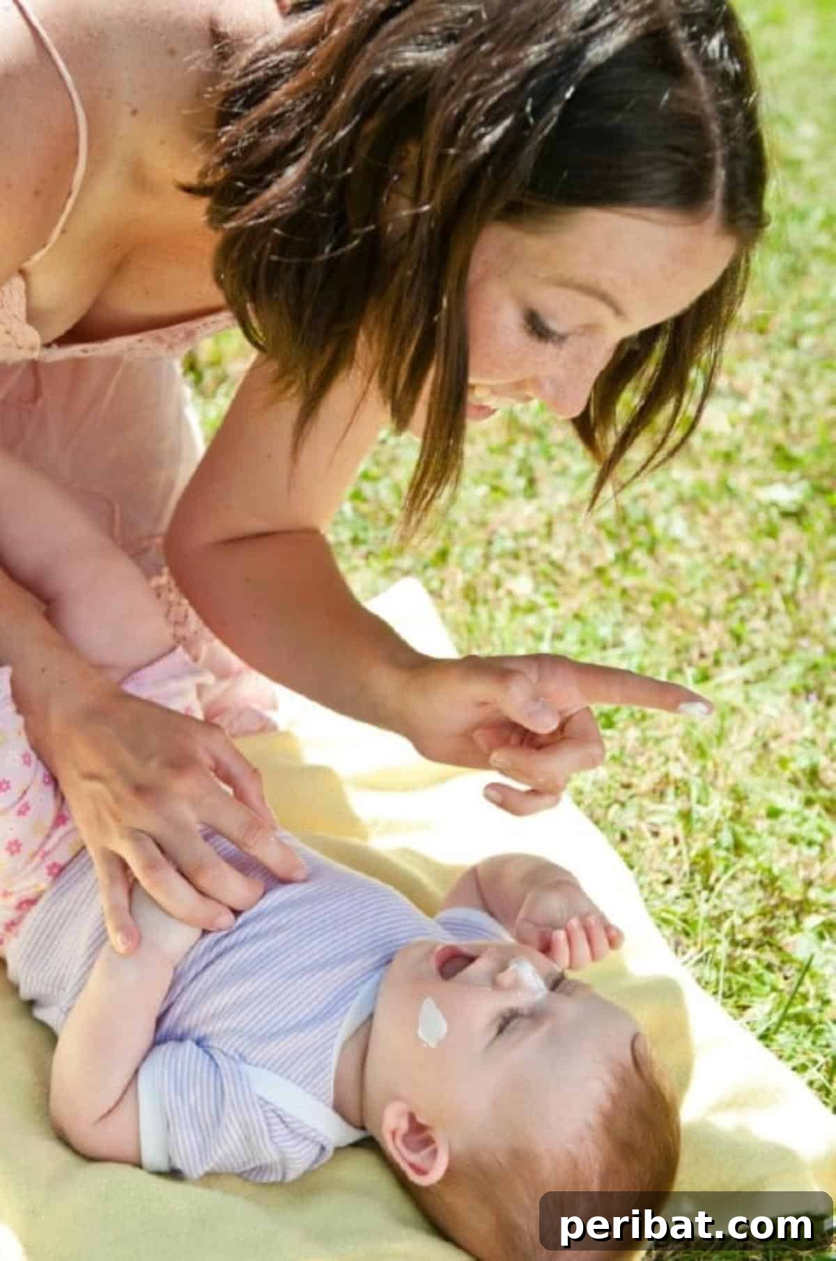 35 DIY Summer Adventures for Your Most Epic Season Yet 34 Mother sunscreens her baby,