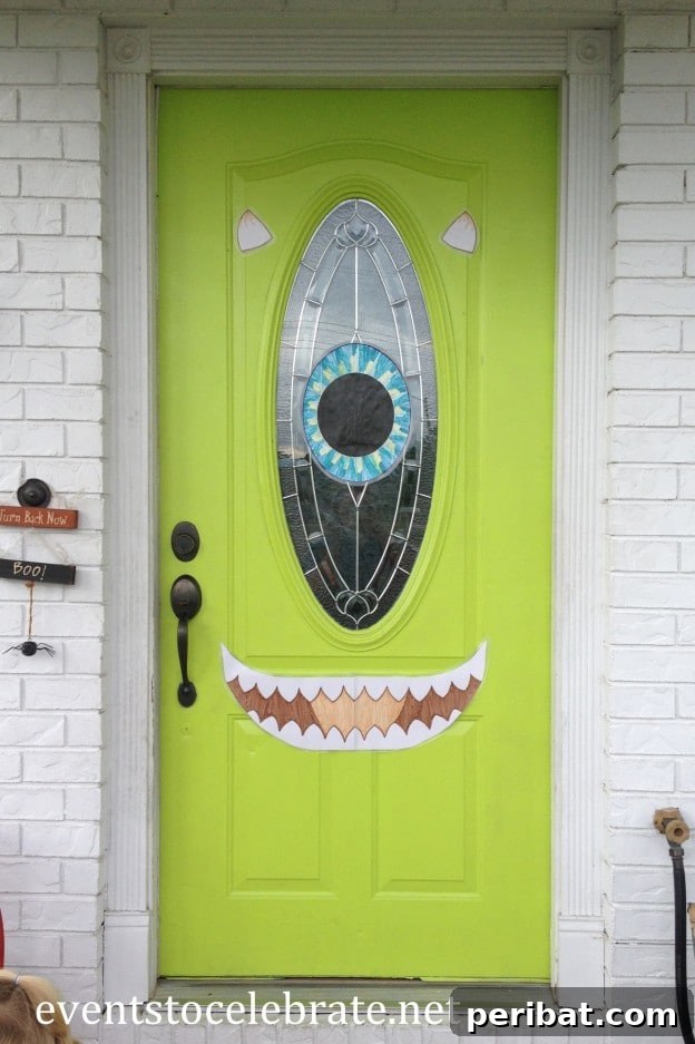 30 Monstrous Ways to Welcome Trick-or-Treaters: Doors & Wreaths for Halloween 5 Mike Wazowski Inspired Front Door Decoration
