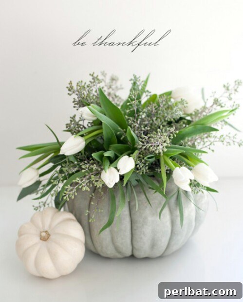 Elegant Floral Arrangement in a pumpkin vase, perfect for fall decor
