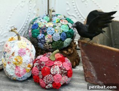 Fabric Yo-Yo Pumpkins with a colorful vintage look, created from gathered fabric circles