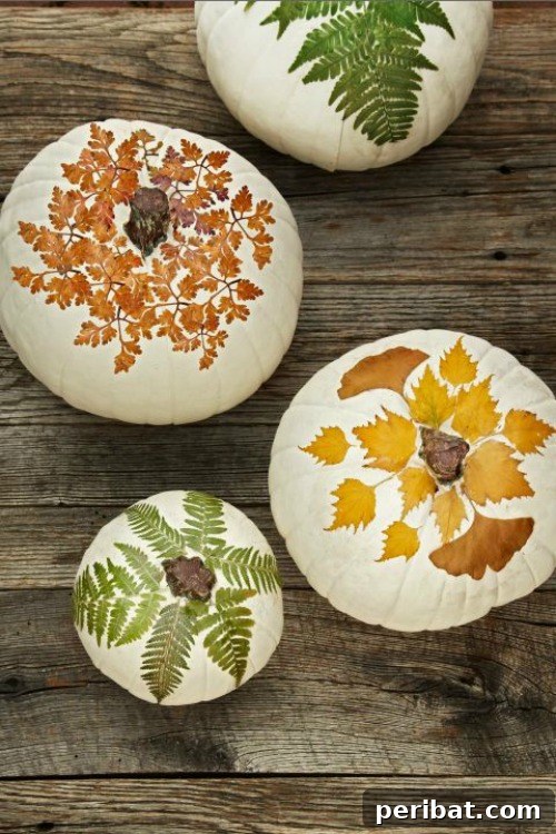 Pressed Foliage Pumpkins decorated with dried leaves using decoupage technique