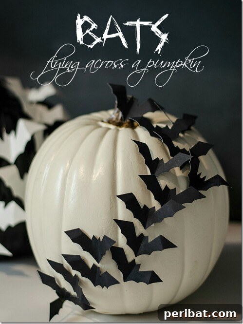 Paper Bats affixed to a white pumpkin for a 3D flying effect, black and white contrast