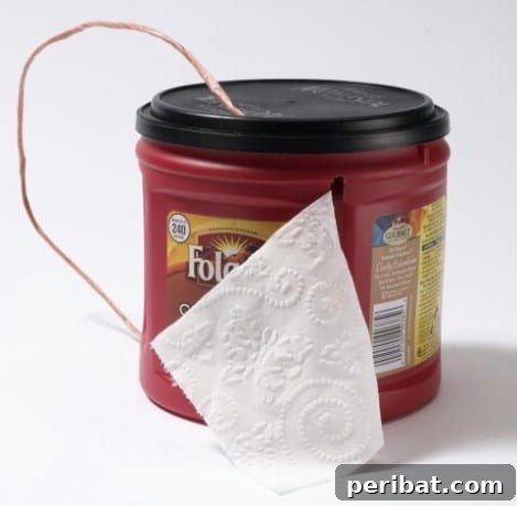 Use a coffee can to hold and protect toilet paper from moisture