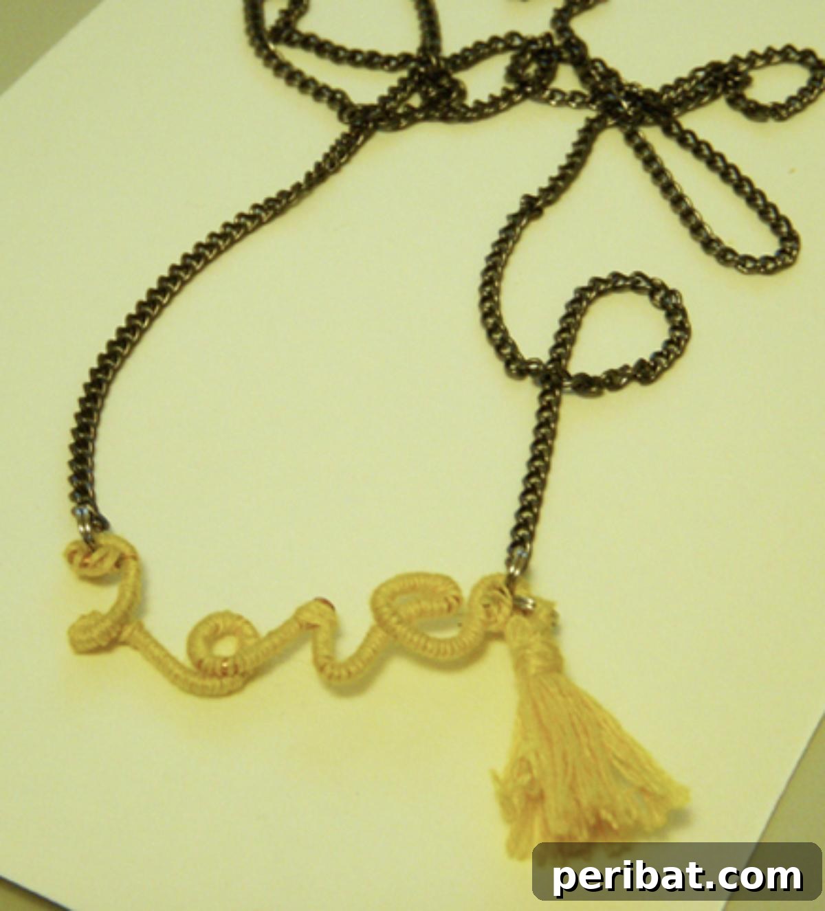 32 Clever Anthropologie Style DIY Projects 24 Anthro Knock-Off Love Necklace, a delicate pendant with a heartfelt message.