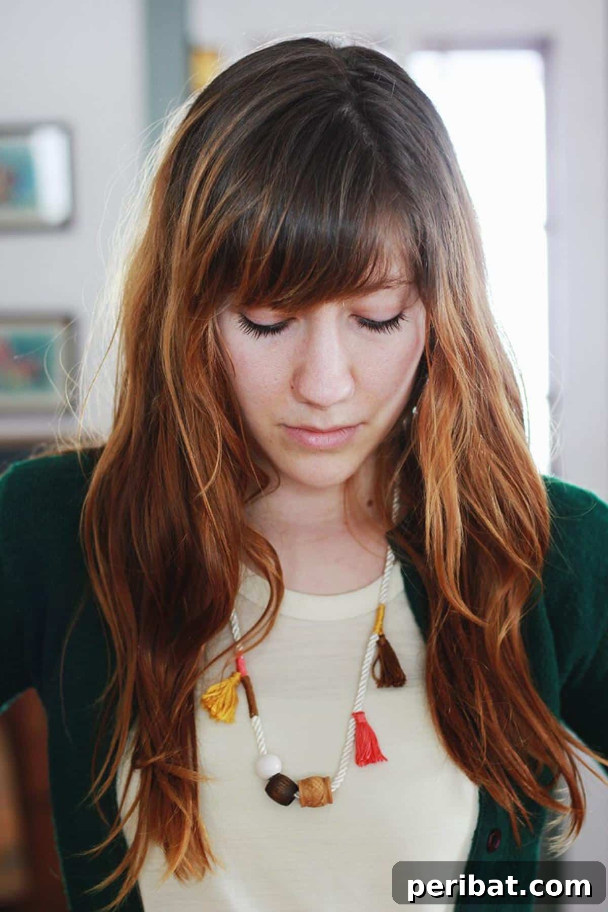 32 Clever Anthropologie Style DIY Projects 31 Anthro Inspired Tassel Necklace, a long, colorful necklace with decorative tassels.