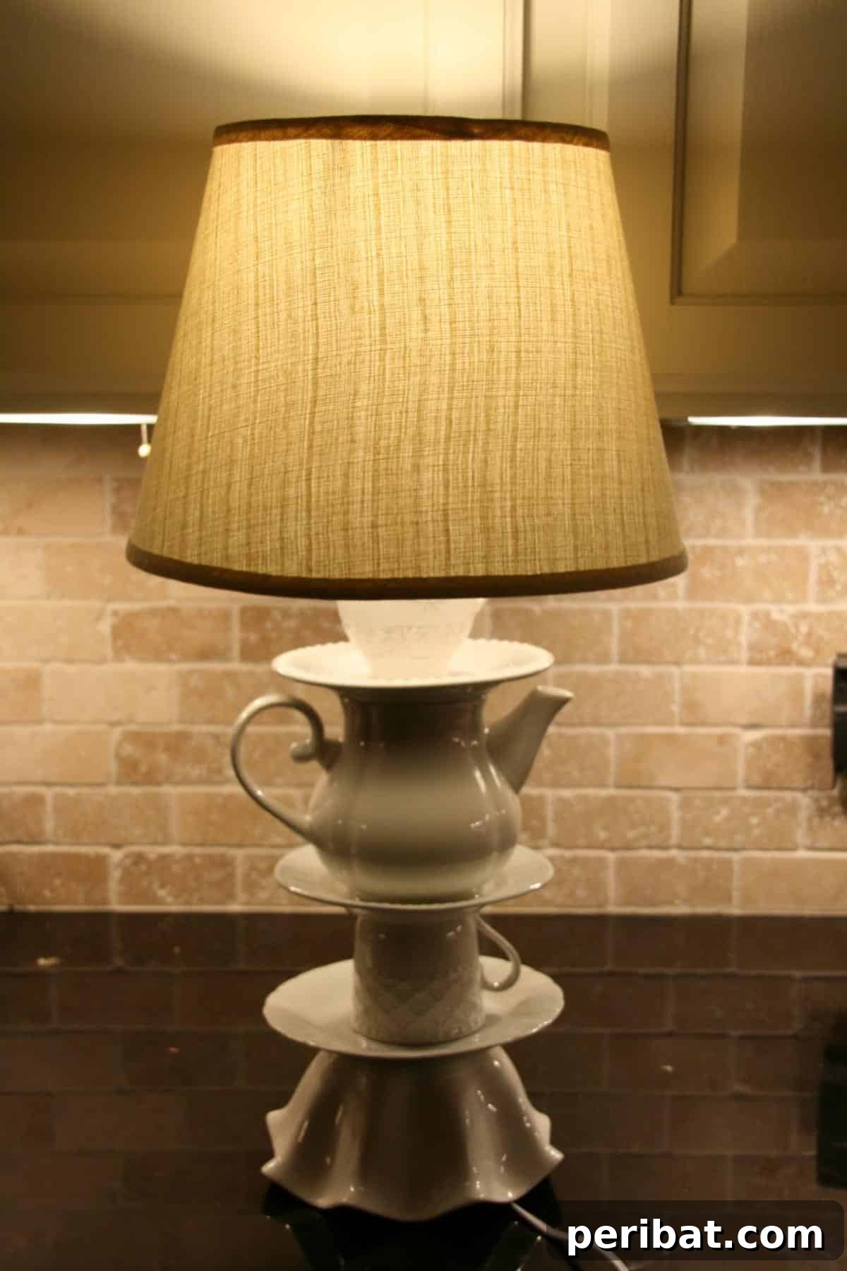 32 Clever Anthropologie Style DIY Projects 32 Better Late Than Never....Anthro Knock Off Lamp, an artistic lamp with layered fabric shade.