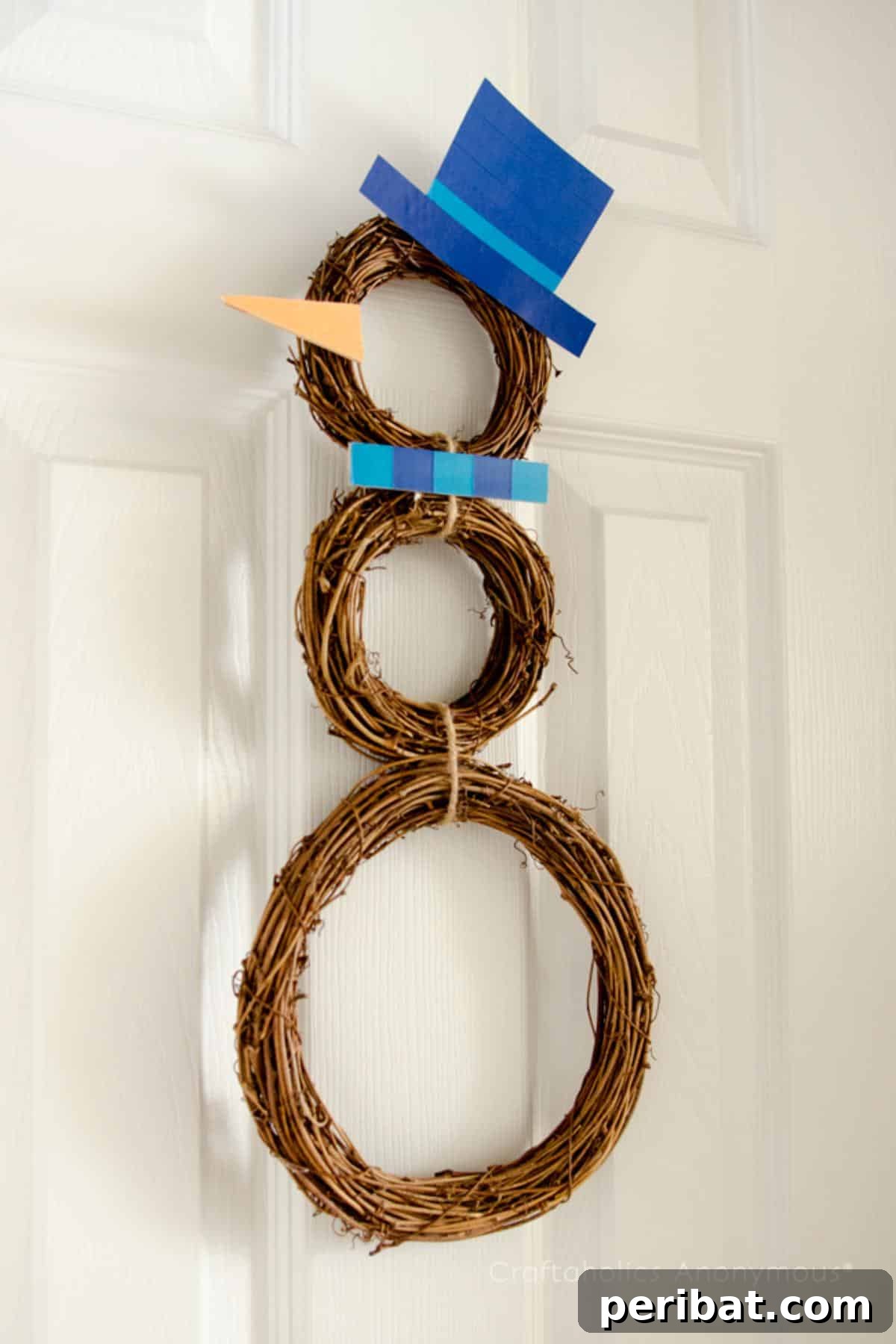 DIY Holiday Door Decorating Ideas for a Joyful Welcome 15 Assemble a rustic and charming DIY Grapevine Snowman Wreath for your holiday door, using different-sized grapevine wreaths and personalized decorations