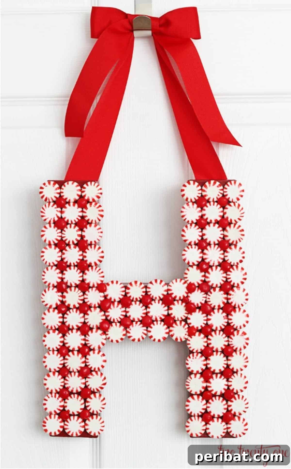 DIY Holiday Door Decorating Ideas for a Joyful Welcome 20 Craft a unique and sweet DIY Candy Letter Hanging for your door, using peppermint candies to form a personalized initial or festive word