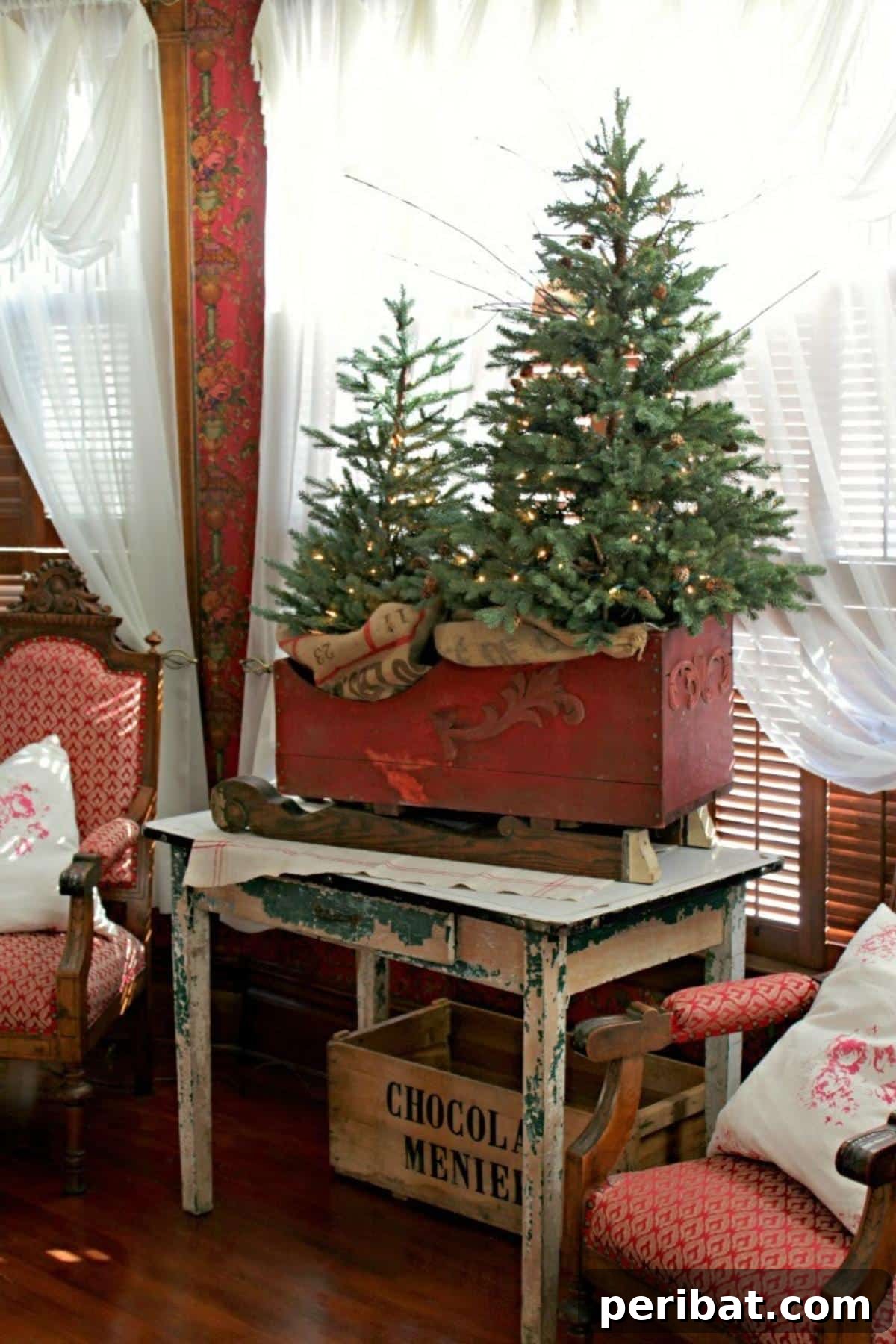 25 DIY Farmhouse Christmas Decor Ideas for a Rustic Country Christmas 14 Christmas Tree Sleigh with miniature trees bundled in burlap for a rustic touch