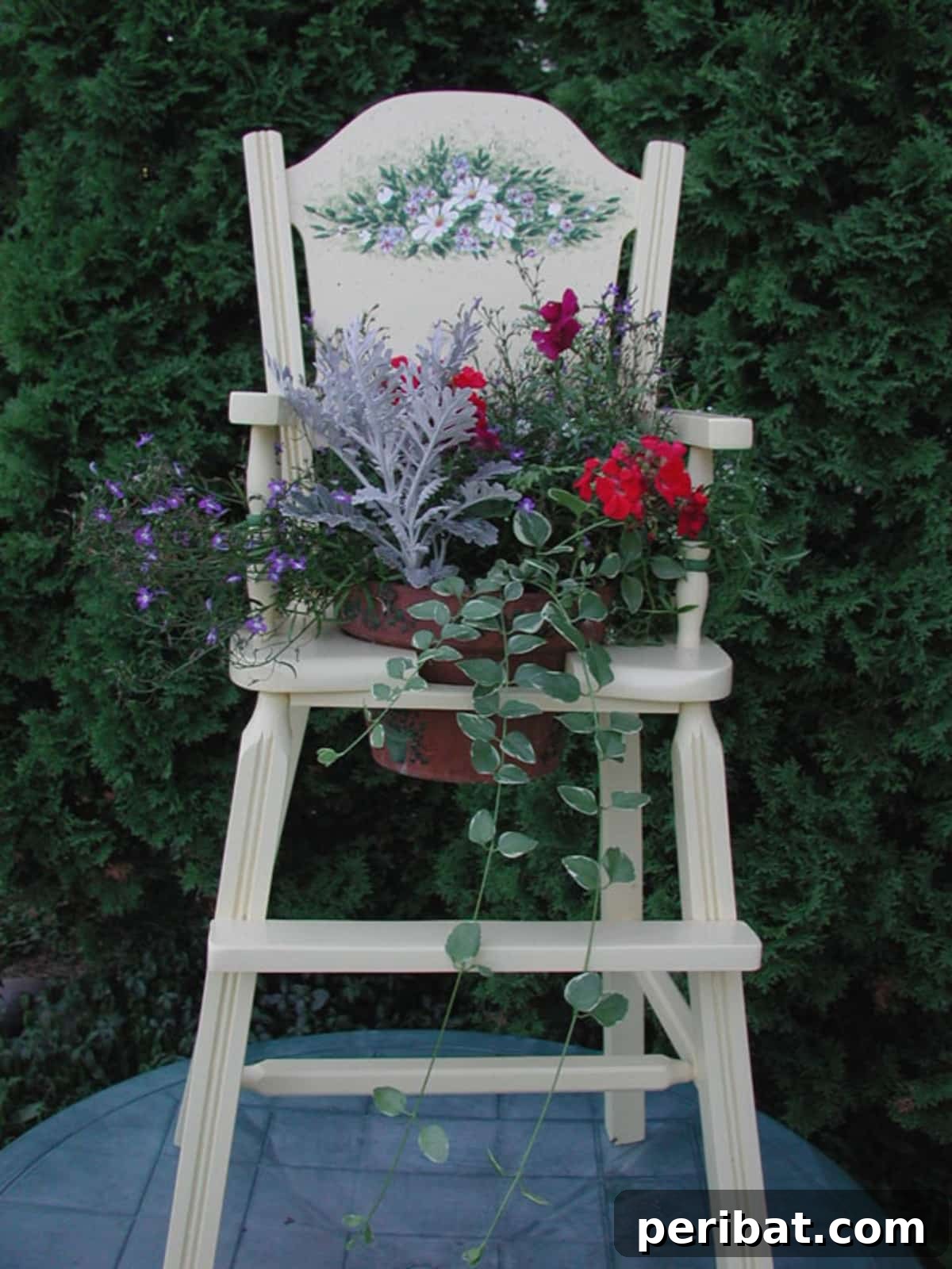 25 DIY Farmhouse Christmas Decor Ideas for a Rustic Country Christmas 23 Farmhouse Chair Planter decorated with a poinsettia for outdoor Christmas charm