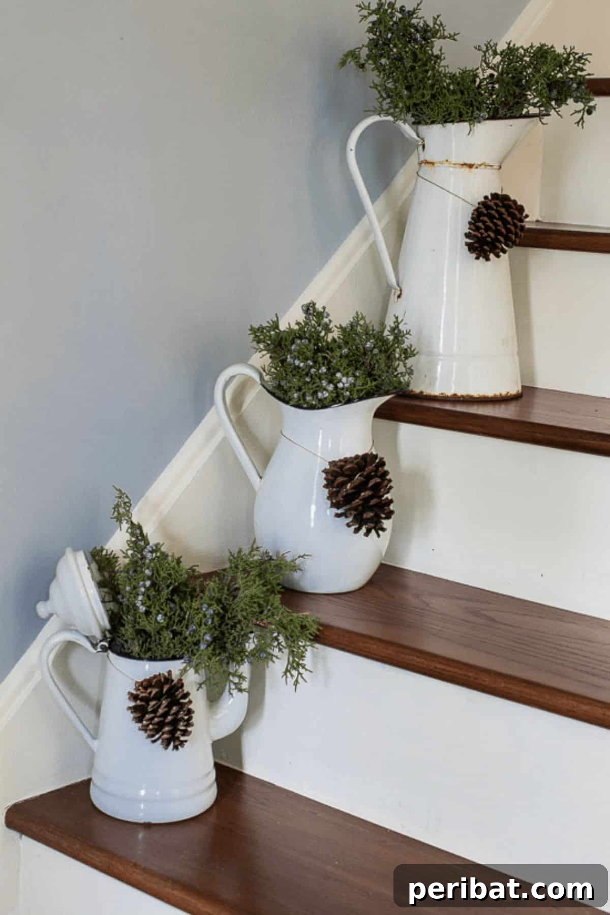 25 DIY Farmhouse Christmas Decor Ideas for a Rustic Country Christmas 5 Rustic Stairway Décor featuring vintage enamelware and juniper sprigs