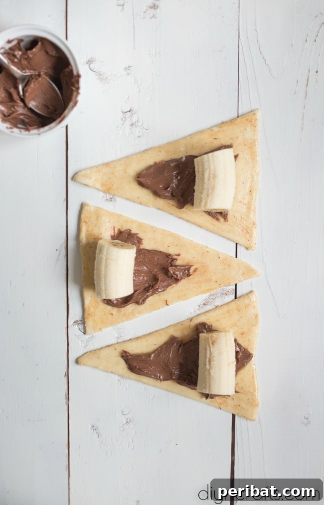 Step 2: Rolling and cutting puff pastry into triangles, then brushing with cinnamon butter.