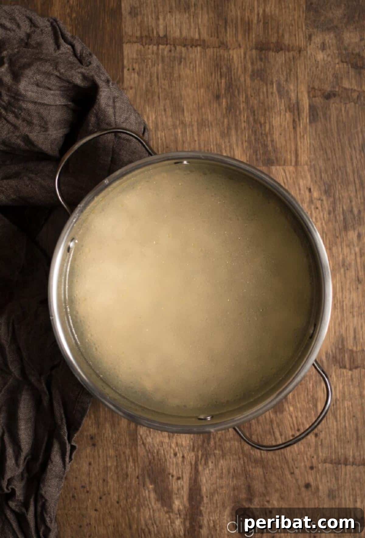 Hearty White Bean and Crispy Bacon Soup: Your Winter Blues Remedy 4 A close-up view of dried white beans soaking in water, a crucial step for preparing the soup.